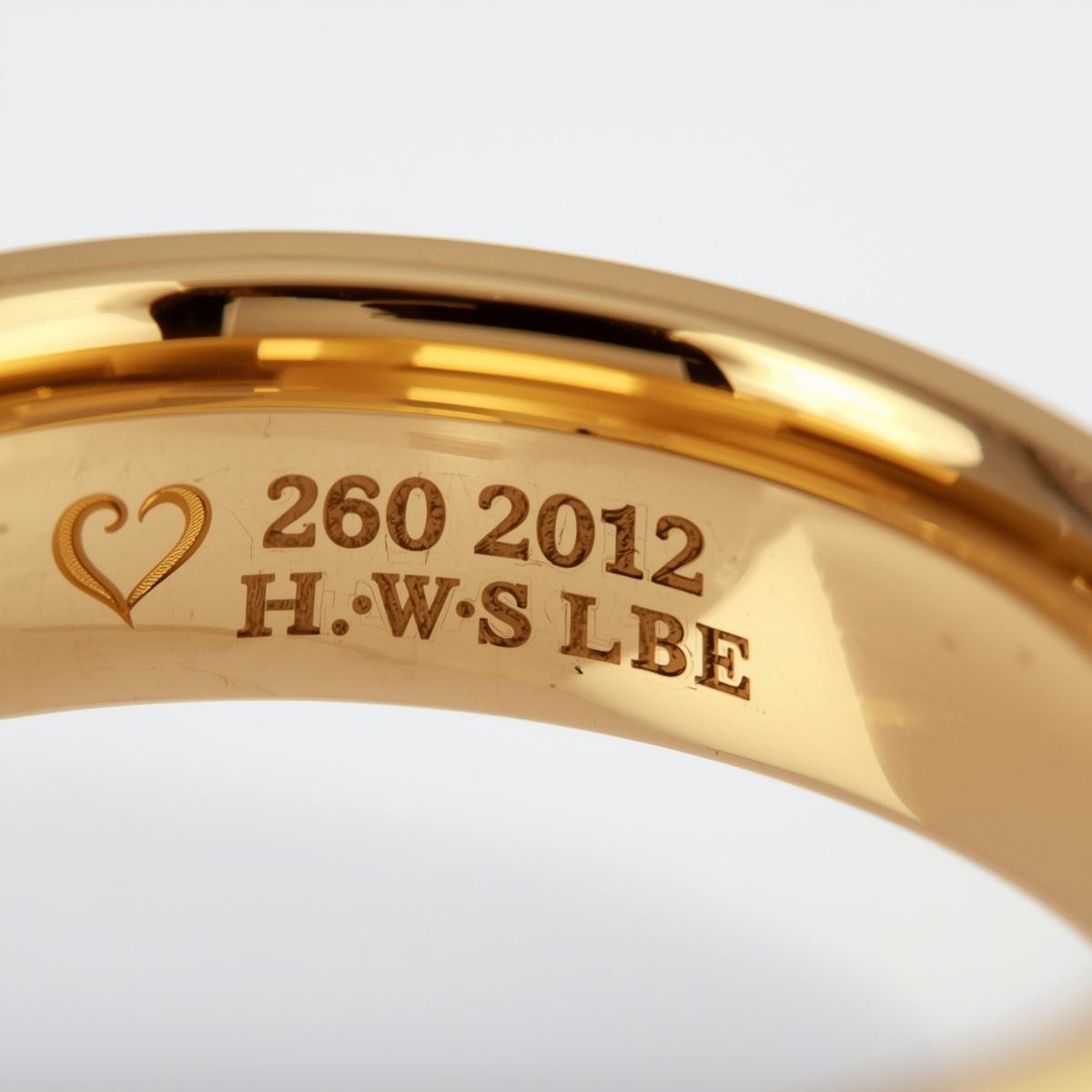 Gold ring with engraved text inside rings