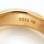 Gold ring with '2016' and a heart engraving inside rings