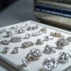 Collection of silver rings with gemstones on a white surface