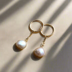 gold hoops with drop peach pearls